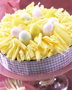 Easter cake with grated white chocolate and Easter eggs