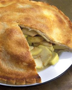 Apple pie, a piece cut, on plate