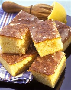 Pieces of lemon cake with icing on cloth