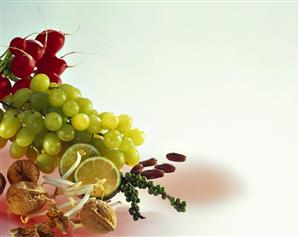 Still life with grapes, sprouts, nuts, green pepper