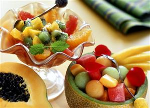 Fruit salad with lemon syrup; melon salad in melon half