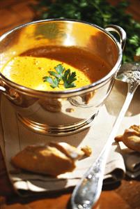 Cream of pepper soup in a silver soup bowl