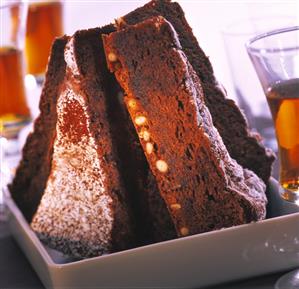 A few pieces of chocolate pine nut cake in a bowl