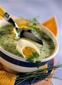 Spring herb soup with boiled egg