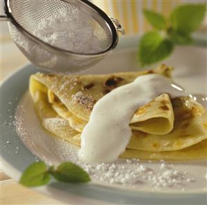 Rhubarb pancakes with vanilla yoghurt and icing sugar