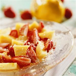 Pineapple salad with strawberries & grated coconut