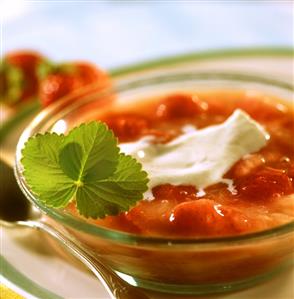 Rhubarb and strawberry cream with cream and strawberry leaf