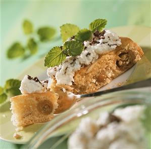 Piece of gooseberry cake with chocolate cream & lemon balm