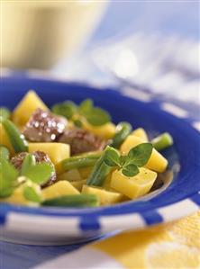 Bean and lamb stew with potatoes and fresh herbs