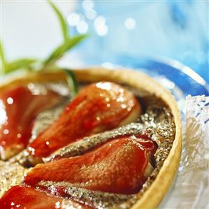 Red pear and poppy seed tart with cranberry sauce