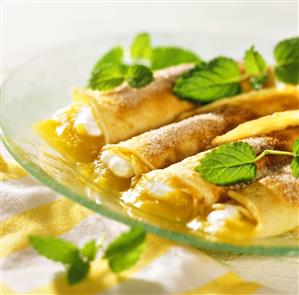 Pancake rolls with apricot puree and lemon balm