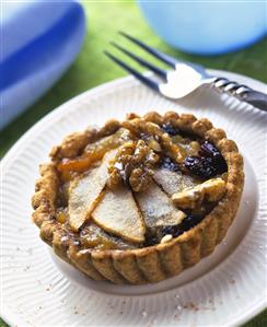 Tartlets with various fruits and walnuts