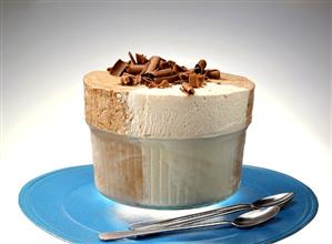 Ice cream souffle with grated chocolate in a glass dish