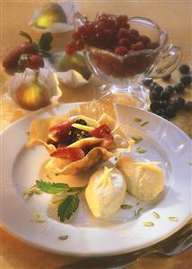 Mango mousse with fruit salad in baked strudel pastry