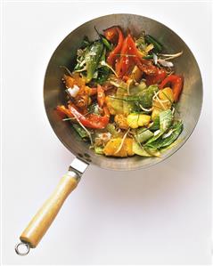 Cabbage with pepper, pineapple, sprouts and sesame in a wok (1)