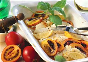 Cod with tamarillos and lemons in baking dish