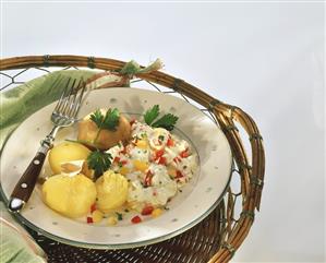 Jacket potatoes with paprika quark on a plate with a fork