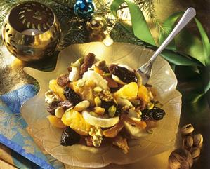 Christmassy fruit salad with nuts and dried fruit