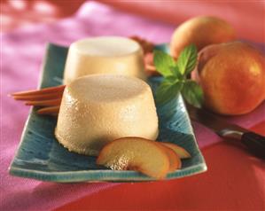 Peach yoghurt mousse with peach slices on plate