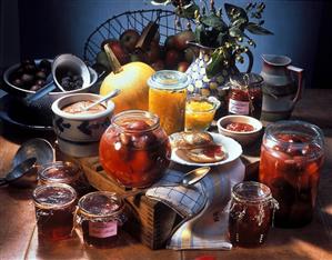 Still life with various jams, fruit and pumpkin