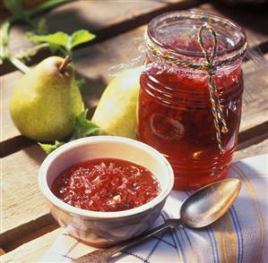 Cranberry and pear jam with cardamom in jar and dish