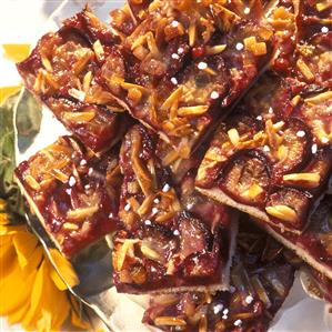 Plum cake with slivered almonds and granulated sugar