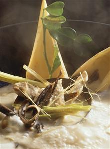 Steaming chicken soup with banana flowers & coconut milk