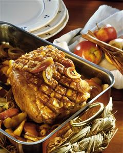 Bavarian roast pork with apples in roasting tin