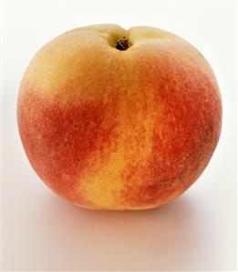 A peach on white background