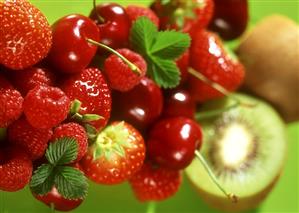 Still life with berries, cherries and kiwi fruits