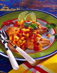 Red snapper with mango salsa and lime slices