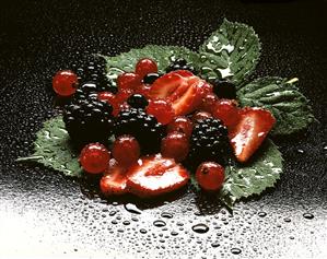 Fresh berries with drops of water on leaves