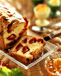 Lemon cake with plums on cake plate