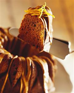 Chocolate fruit cake with coffee icing and orange zest