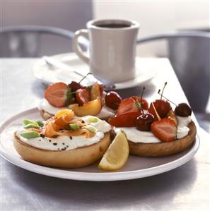 Bagels with salmon and fruit for breakfast