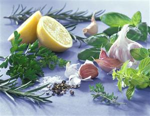 Fresh herbs, garlic, lemon, pepper and salt