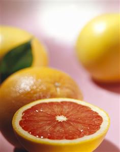 Pink grapefruits, one halved