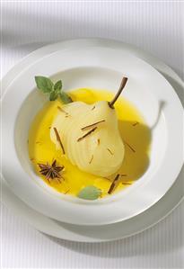 Poached pear in saffron sauce with star anise