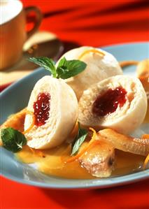 Cranberry dumplings with bananas in orange sauce