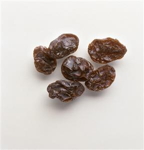 Raisins on a white background