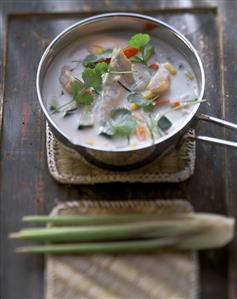 Chicken soup with coconut milk and coriander leaves