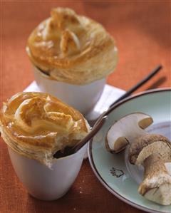 Cep consomme with puff pastry topping in white cups (1)