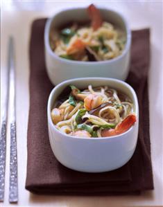 Vietnamese noodle soup with shrimps, spinach and mushrooms