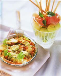 Courgette gratin; melon with Parma ham and grissini (2)