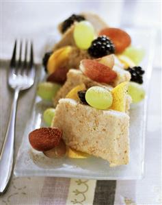 Semolina halva with fresh berries, grapes and pears