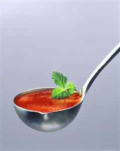 Strawberry soup in a ladle