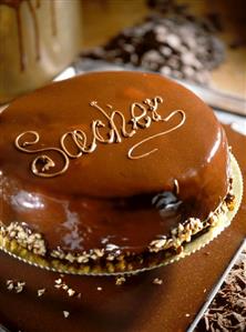 Sacher torte with the word Sacher on a tray