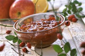 Rosehip and apple preserve in glass bowl