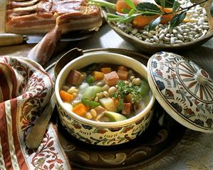 Serbian bean soup with bacon, leeks and carrots