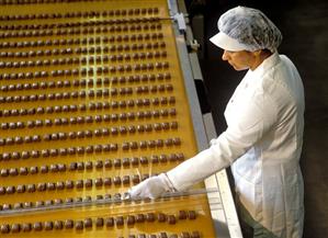 Female worker making chocolates